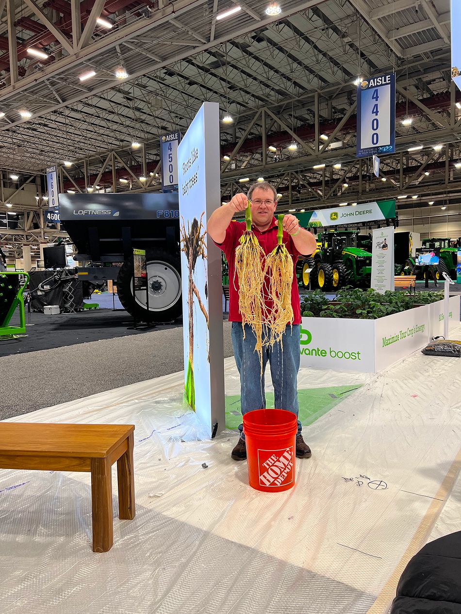 Overview of the Biovante exhibition booth, showcasing plant displays and branding.